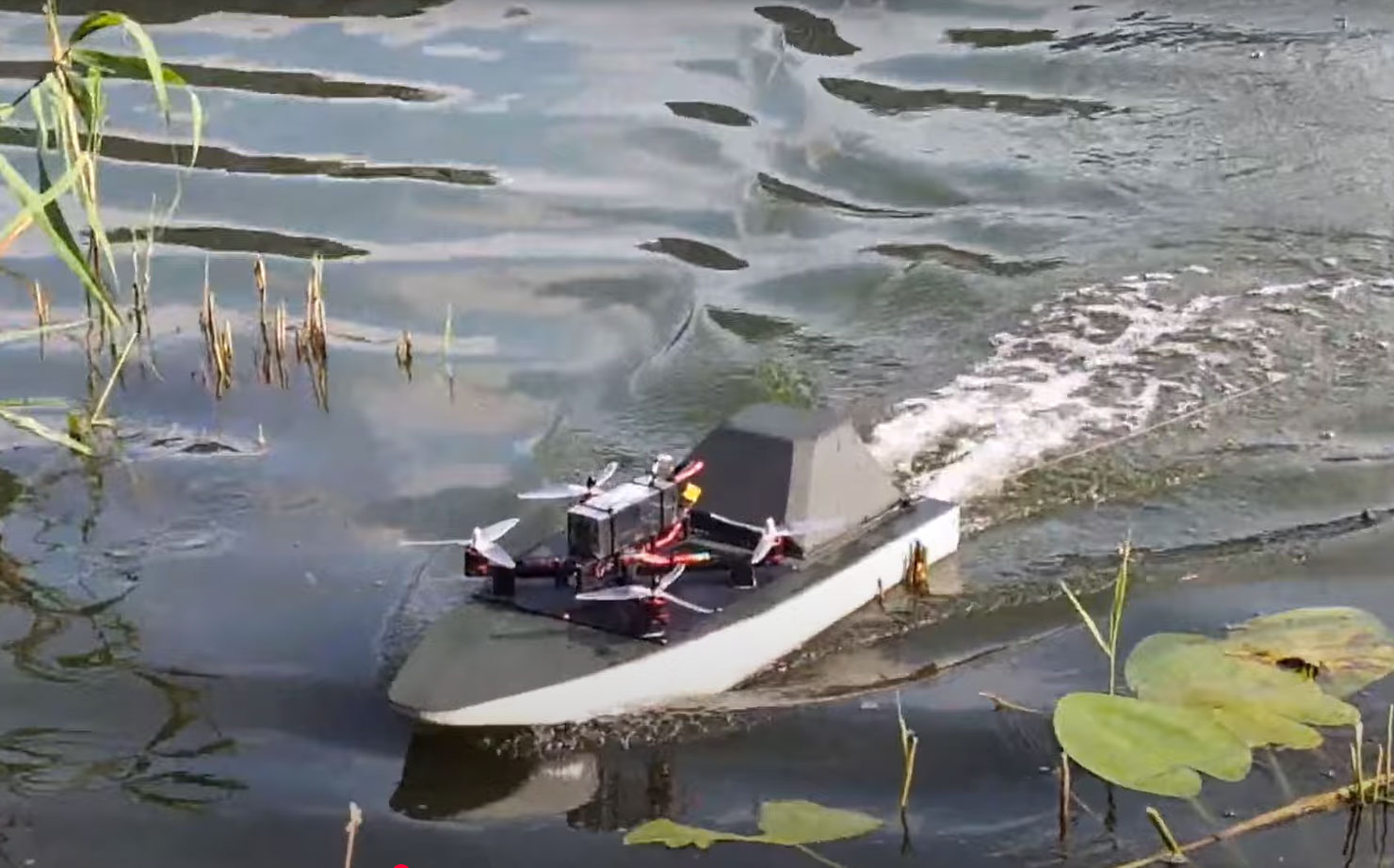 ukraine unveils ursula river drone kamikaze mode — flying onboard ukrainian unmanned riverine surface developed novitechnet carrying uav 2025 youtube/association engineers ukrainian-riverine-surface-drone-ursula-carrying-a-uav its multi-function build meant complex sabotage operations dense