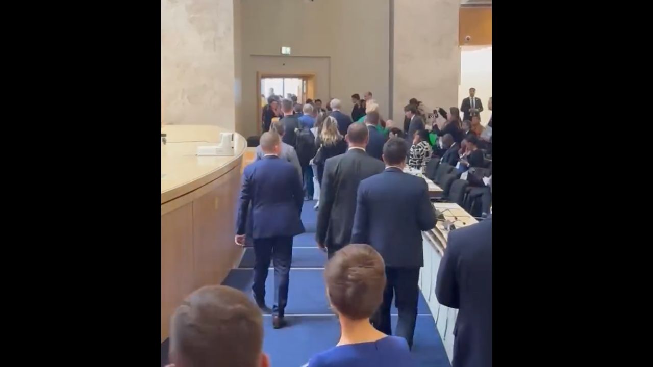 Dozens of parliamentarians abandon hall as Russian sanctioned official takes podium and spreads propaganda at an international conference in neutral Switzerland.