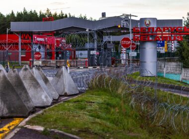 Concrete anti-tank barriers known as "dragon's teeth" are positioned at a Lithuania-Belarus border crossing point. The triangular obstacles are part of Lithuania's defensive measures to strengthen border security and restrict vehicle movement as part of the planned Baltic Defense Line.