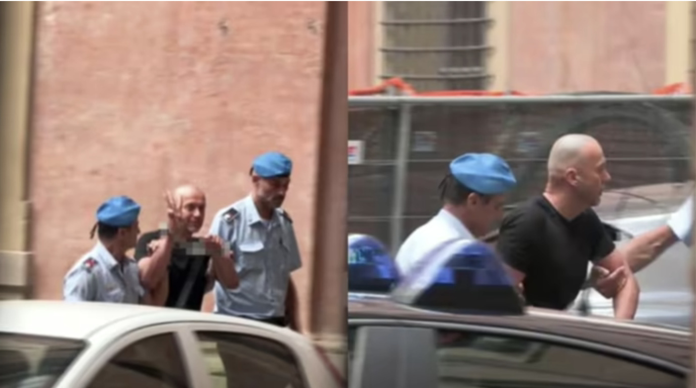 Ukrainian suspect Serhii Kuznetsov makes the three-finger trident gesture while surrounded by Italian police officers during his detention in Italy on 20 August, where he was arrested on charges related to the 2022 Nord Stream pipeline attacks.