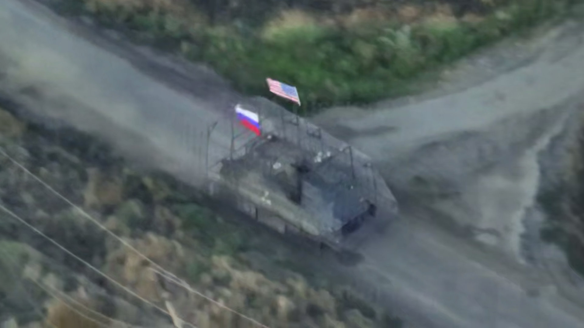 Russian military vehicle with US and Russian flags.