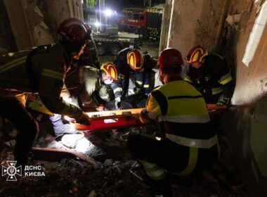 Emergency workers recover the body of a third victim from the rubble of a destroyed apartment building in Kyiv's Sviatoshynsky district following Russian attack on 7 September.