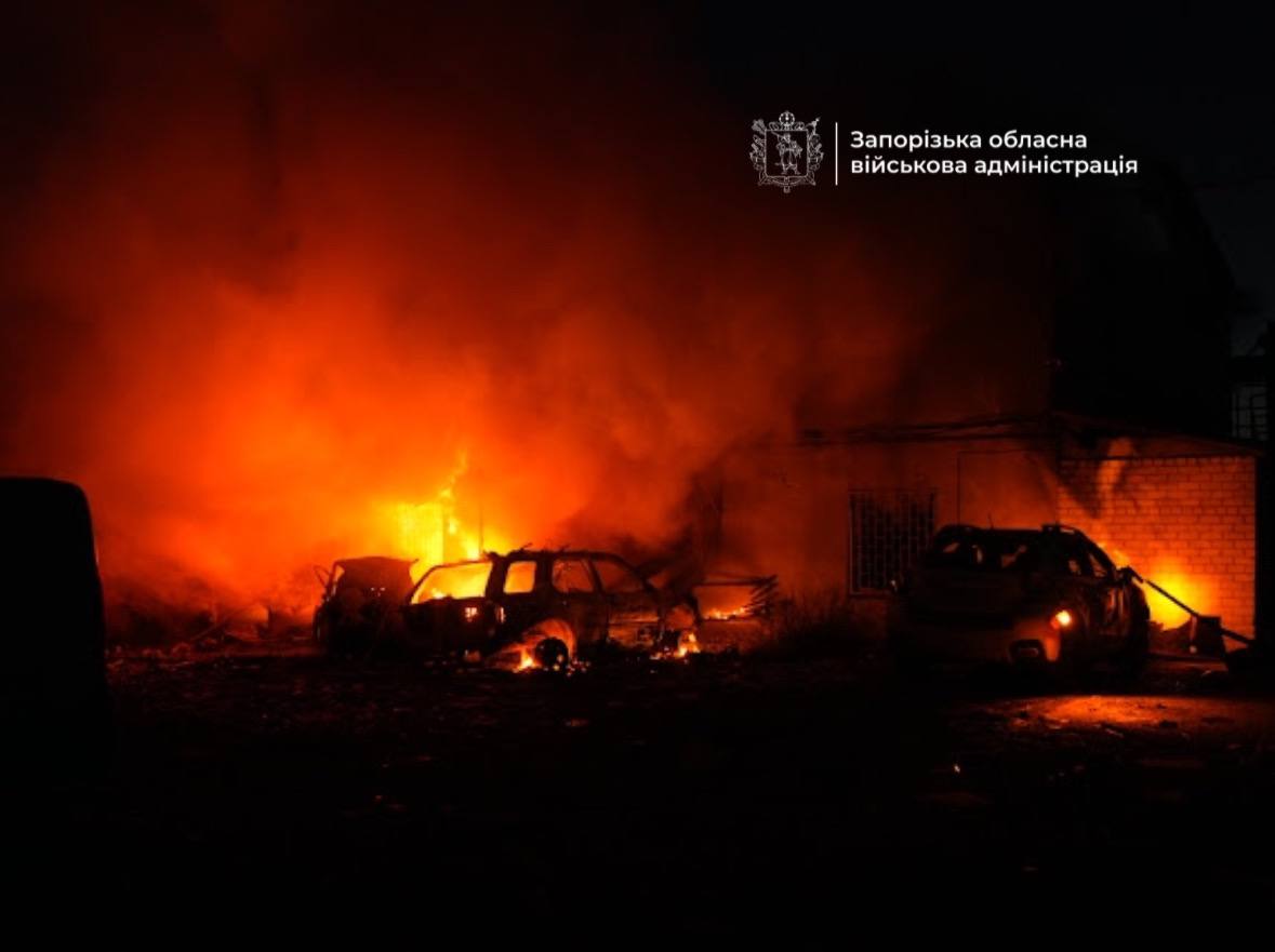 Burned-out vehicles smolder in Zaporizhzhia following Russian aerial bomb attacks on 22 September 2025. The strikes killed three civilians and damaged residential areas across the city.