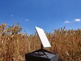A Starlink satellite terminal set up in a Ukrainian wheat field. Illustrative image shared by Digital Minister Mykhailo Fedorov via Telegram