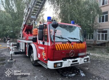 Fire truck in Kramatorsk with damage from debris, in the area struck by a second Russian drone while firefighters worked.