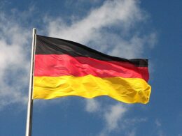German flag waving against the sky.