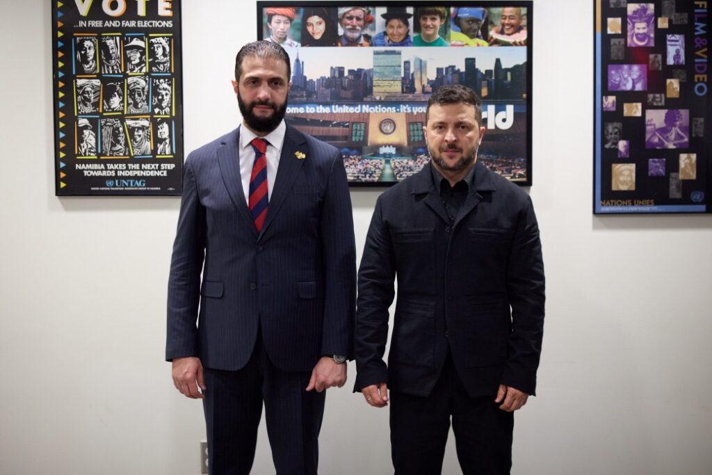 Ukrainian President Volodymyr Zelenskyy (right) meets with Syrian leader Ahmed Hussein al-Sharaah (left) in New York during the UN summit, where the two countries signed a joint communiqué restoring diplomatic relations.