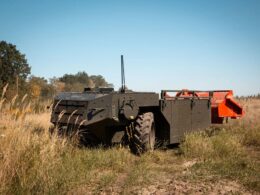 ai sees diesel drives armor protects—ukraine’s 4-ton ground drone bufalo designed endure war equipped demining mulcher attachment photographed during field testing grassy terrain mezhamedia land new ukrainian military robot rolling