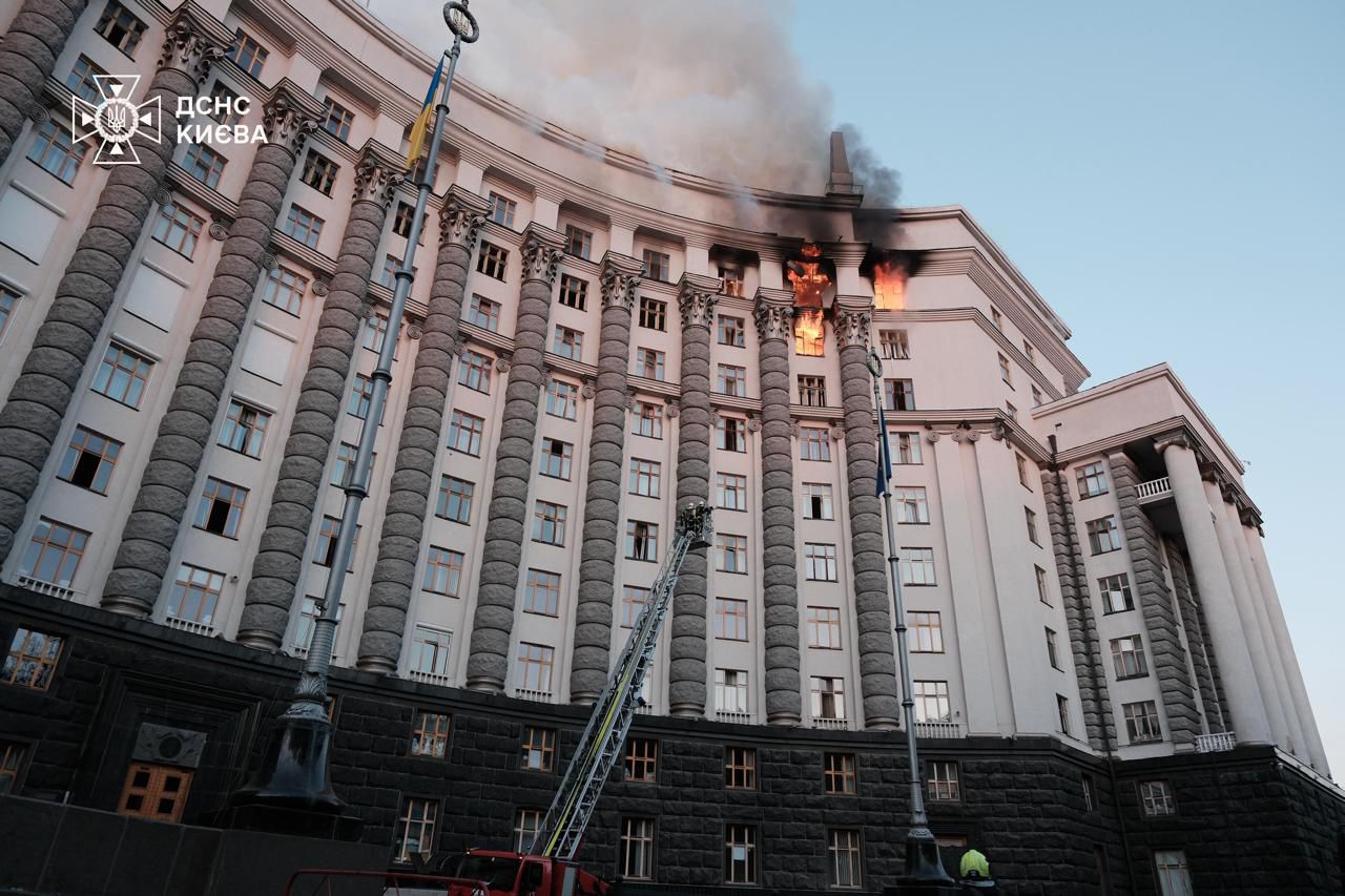 Partially destroyed government building in Kyiv after Russian missile and drone attack, with visible damage to roof and upper floors.