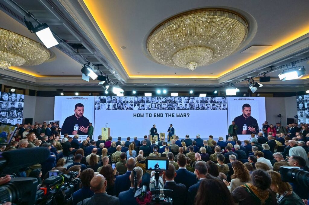Ukrainian President Volodymyr Zelenskyy speaks before an audience.