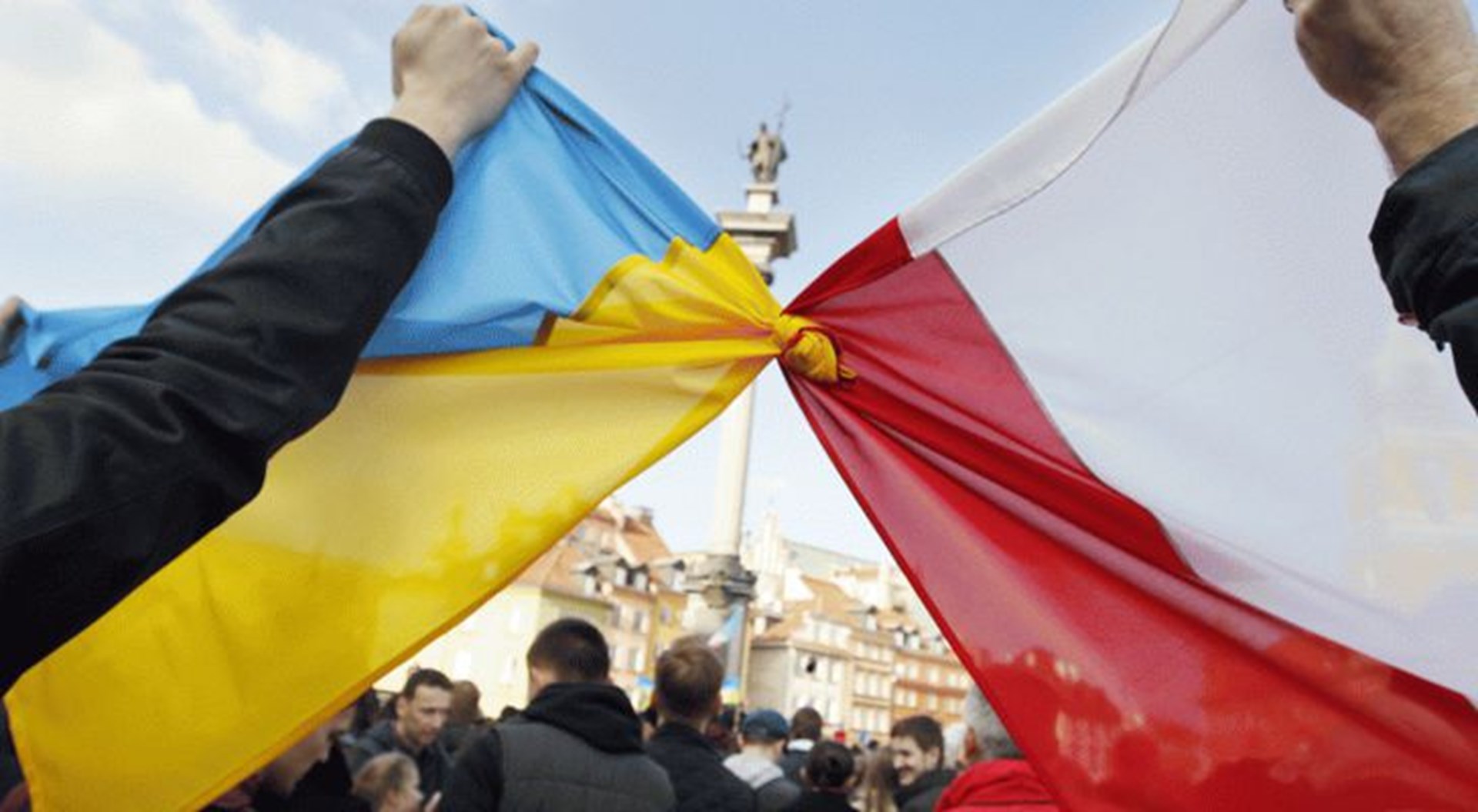 Polish and Ukrainian flags tied together at a rally in Kyiv.