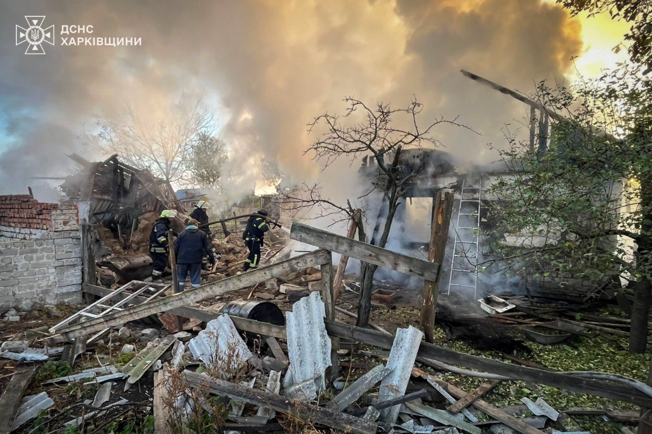 Ukrainian rescuers work to extinguish flames at a destroyed private home in Orilka, Kharkiv Oblast, after a Russian Shahed drone strike injured a family of four on 20 October.