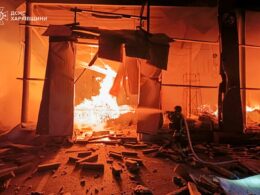 A rescuer works to extinguish fires at a production building at a civilian enterprise in Kharkiv Oblast following Russian drone strikes on 29 October.