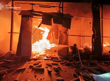 A rescuer works to extinguish fires at a production building at a civilian enterprise in Kharkiv Oblast following Russian drone strikes on 29 October.