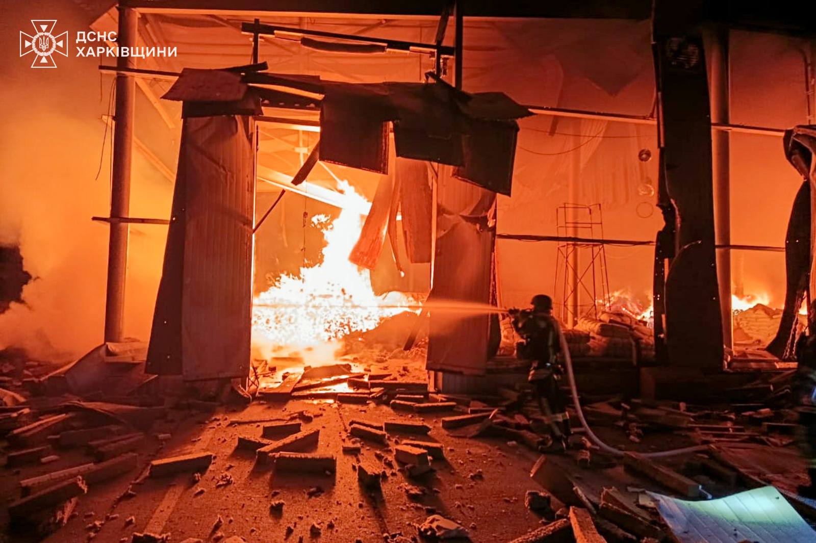 A rescuer works to extinguish fires at a production building at a civilian enterprise in Kharkiv Oblast following Russian drone strikes on 29 October.