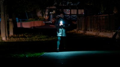 chernihiv left blackouts hot water russia restarts power grid strikes campaign ahead winter woman walks flashlight during blackout 347f0b07ec6caf24 city confirms boiler shutdowns rolling outages after drone strike nearby slavutych