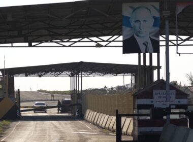 Entrance to the Khmeimim Air Base with Russian presence after Assad's Fall. The Image of Bashar al-Assad torn down by Russian Soldiers