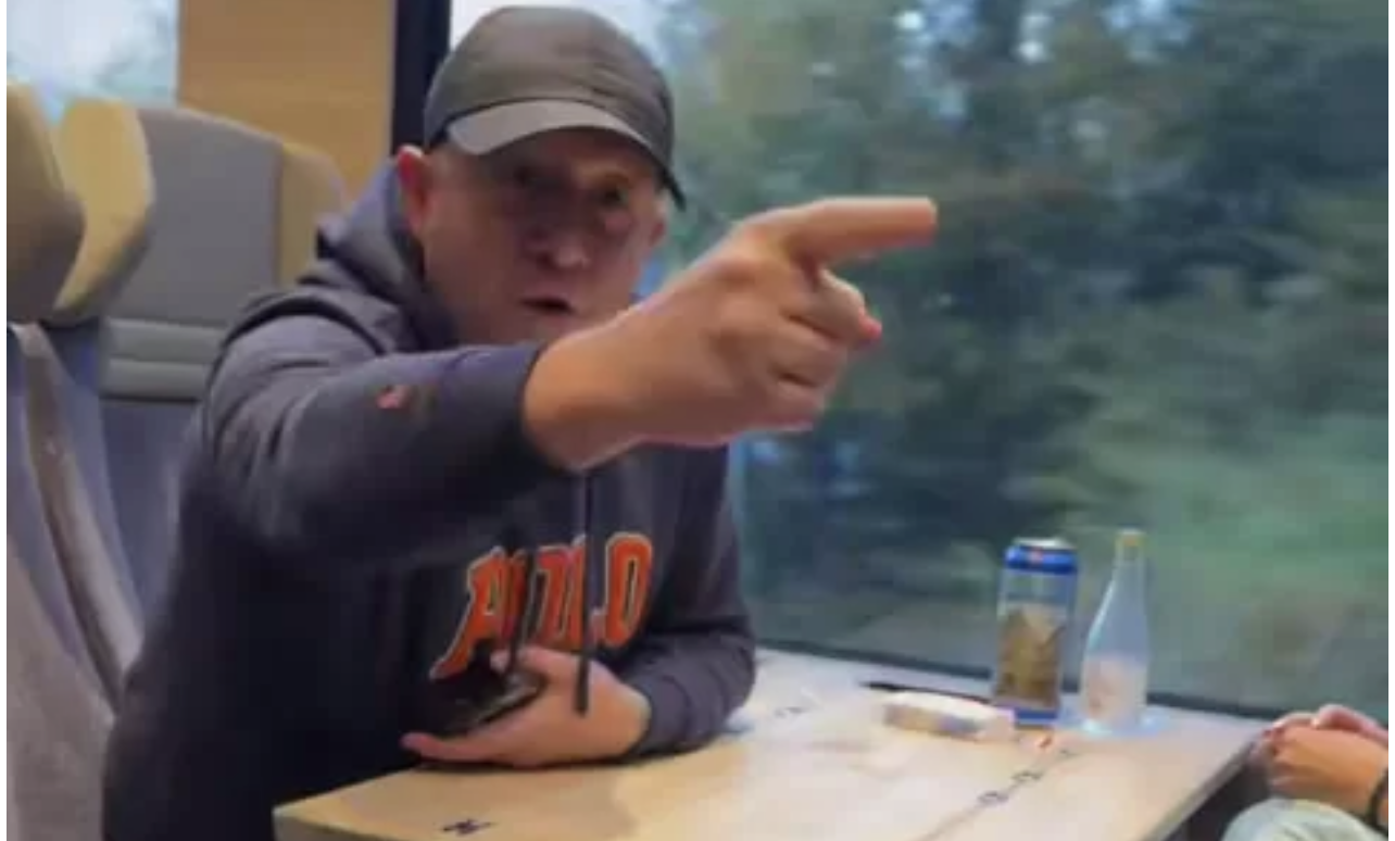 A screenshot from video shows Russian-speaking Latvian citizen Aleksandrs Vabiks gesturing aggressively at a Ukrainian family on a Swiss train after he heard them speaking Ukrainian, 13 October.