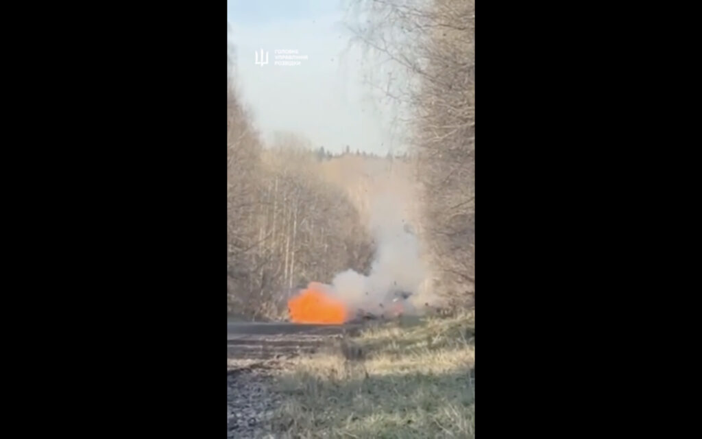A burning vehicle on a road in Kemerovo Oblast, Russia, in footage released by Ukraine's Defense Intelligence (HUR) showing the 25 October explosion that allegedly killed police Lieutenant Colonel Veniamin Mazzherin linked to war crimes in Kyiv Oblast in 2022.