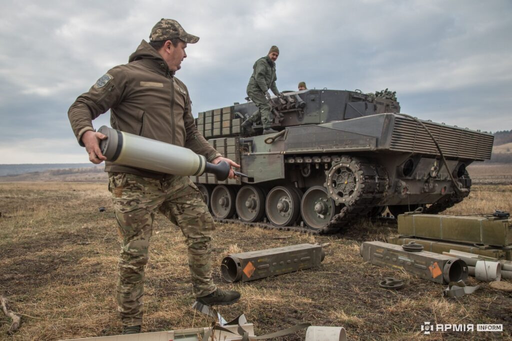 ukraine now makes nato-standard tank shells abrams leopard 2 tanks · post crew member ukrainian army 2a4 carrying 120 mm shell during field loading armyinform image_672f38bb44146779194270 news reports