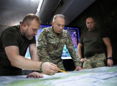 Commander-in-Chief of the Armed Forces of Ukraine, General Oleksandr Syrskyi (center), reviewing a military map with Ukrainian officers in Donetsk Oblast on 4 October 2025