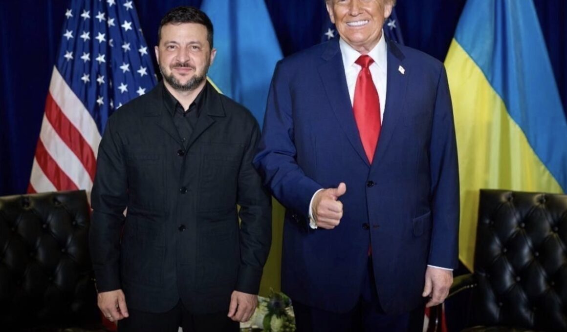 Ukrainian President Volodymyr Zelenskyy and US President Donald Trump stand together in front of Ukrainian and US flags after their meeting