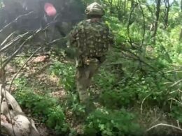 three russians killed radios maps captured — ukrainian commandos strike behind (video) · post special forces operator moves through forested terrain during raid russian lines donetsk oblast commando mission operations