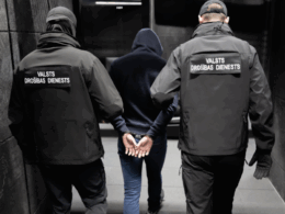 latvia says caught russian-linked arsonists scouting targets filming sensitive facilities planning more fires · post latvian state security service officers escort detained suspect during operation vdd vdd-veic-aizturesanu latvia’s (vdd) has