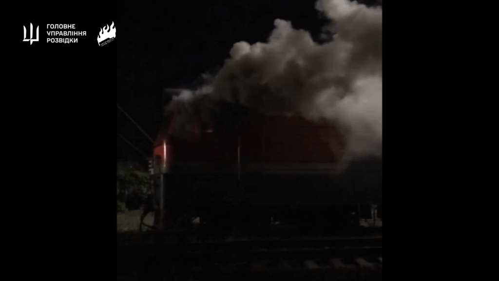 Smoke rises from a burning train after reported "Freedom of Russia" partisan sabotage inside Russia. Screenshot from video.