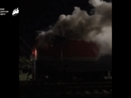 Smoke rises from a burning train after reported "Freedom of Russia" partisan sabotage inside Russia. Screenshot from video.