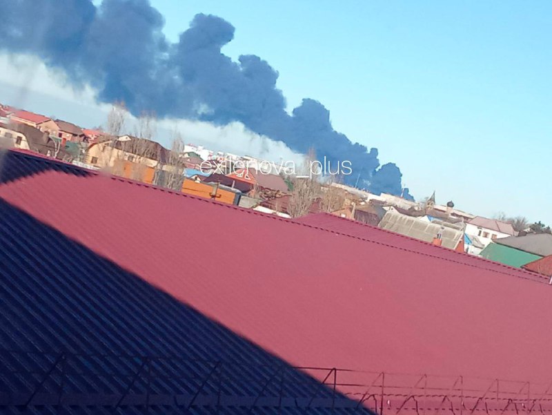 drone attack ignites massive fire russian oil hub near crimea · post thick plumes smoke rise temryuk port area krasnodar krai morning 25 2025 following overnight strike резервуары порта в