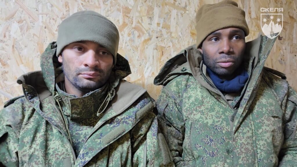 Two Colombian men in Russian military uniforms after being captured by Ukrainian forces near Pokrovsk