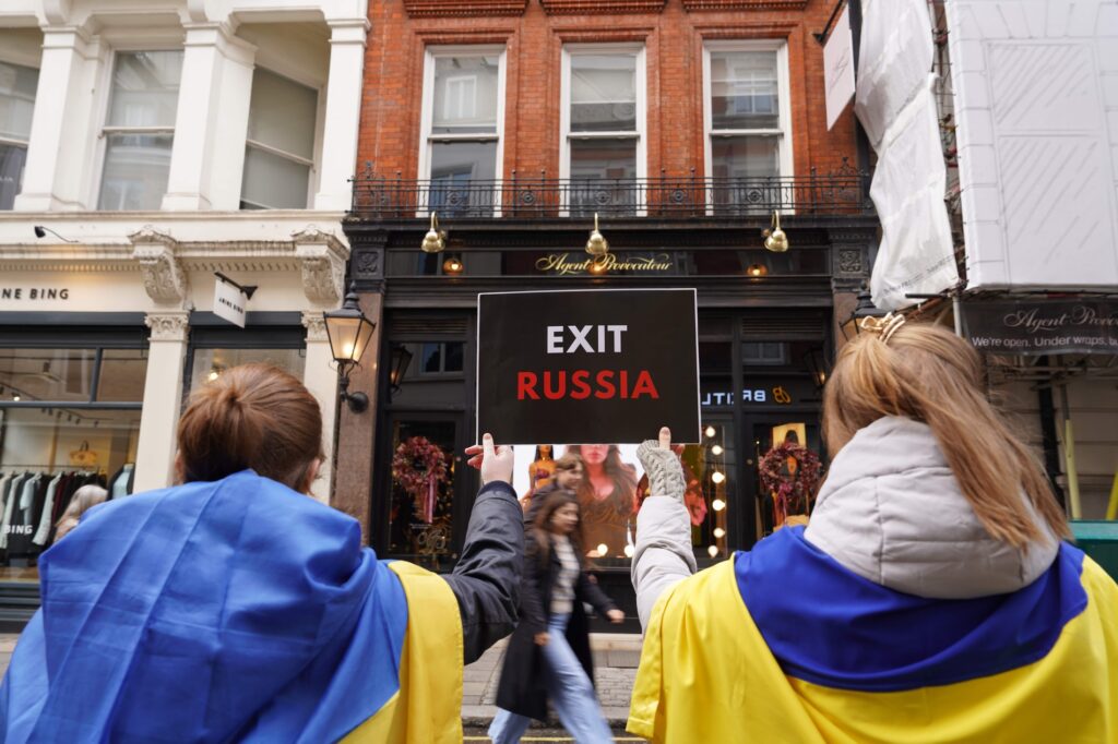 Ukrainian activists outside an Agent Provocateur store in London, protesting over the company's continued operations in Russia. protest luxury brands Ukrainian activists businesses exit Russia business boycott