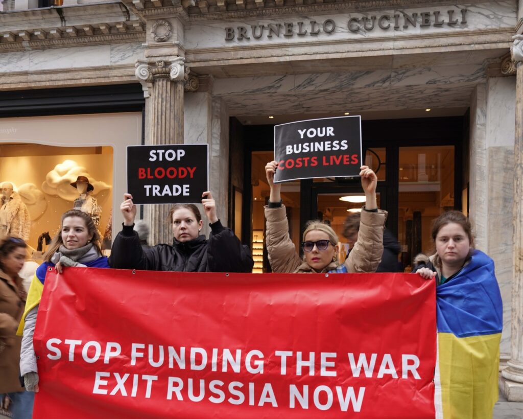 Ukrainian activists outside an Brunello Cucinelli store in London, protesting over the company's continued operations in Russia. protest luxury brands Ukrainian activists businesses exit Russia business boycott