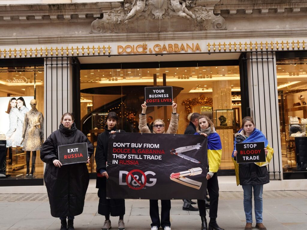 Ukrainian activists outside a Dolce & Gabbana store in London, protesting over the company's continued operations in Russia. protest luxury brands Ukrainian activists businesses exit Russia business boycott