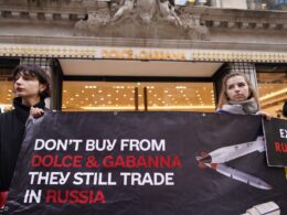 Ukrainian activists outside a Dolce & Gabbana store in London, protesting over the company's continued operations in Russia. protest luxury brands Ukrainian activists businesses exit Russia business boycott