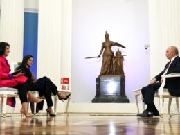 Putin sits across from two India Today journalists in an ornate Kremlin hall with white columns and a bronze statue, December 2025