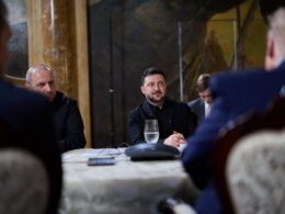 Ukrainian President Volodymyr Zelenskyy sits at a table during a summit at Mar-a-Lago, Florida