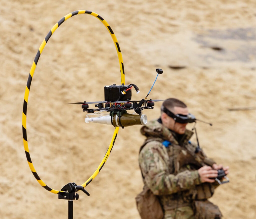 A Ukrainian soldier is training how to operate a small drone carrying a munition. Courtesy: SBS