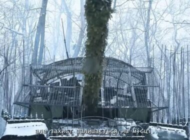 116th Mechanized Brigade tank with rotating anti-drone armor.