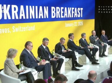 European and US officials seated on stage at the Ukrainian Breakfast in Davos, with Ukraine's blue and yellow colors displayed on the backdrop, January 2026