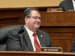 Rep. Randy Fine, Republican congressman from Florida, wearing a gray suit and red tie during a House committee hearing