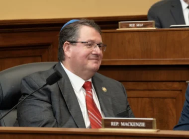 Rep. Randy Fine, Republican congressman from Florida, wearing a gray suit and red tie during a House committee hearing