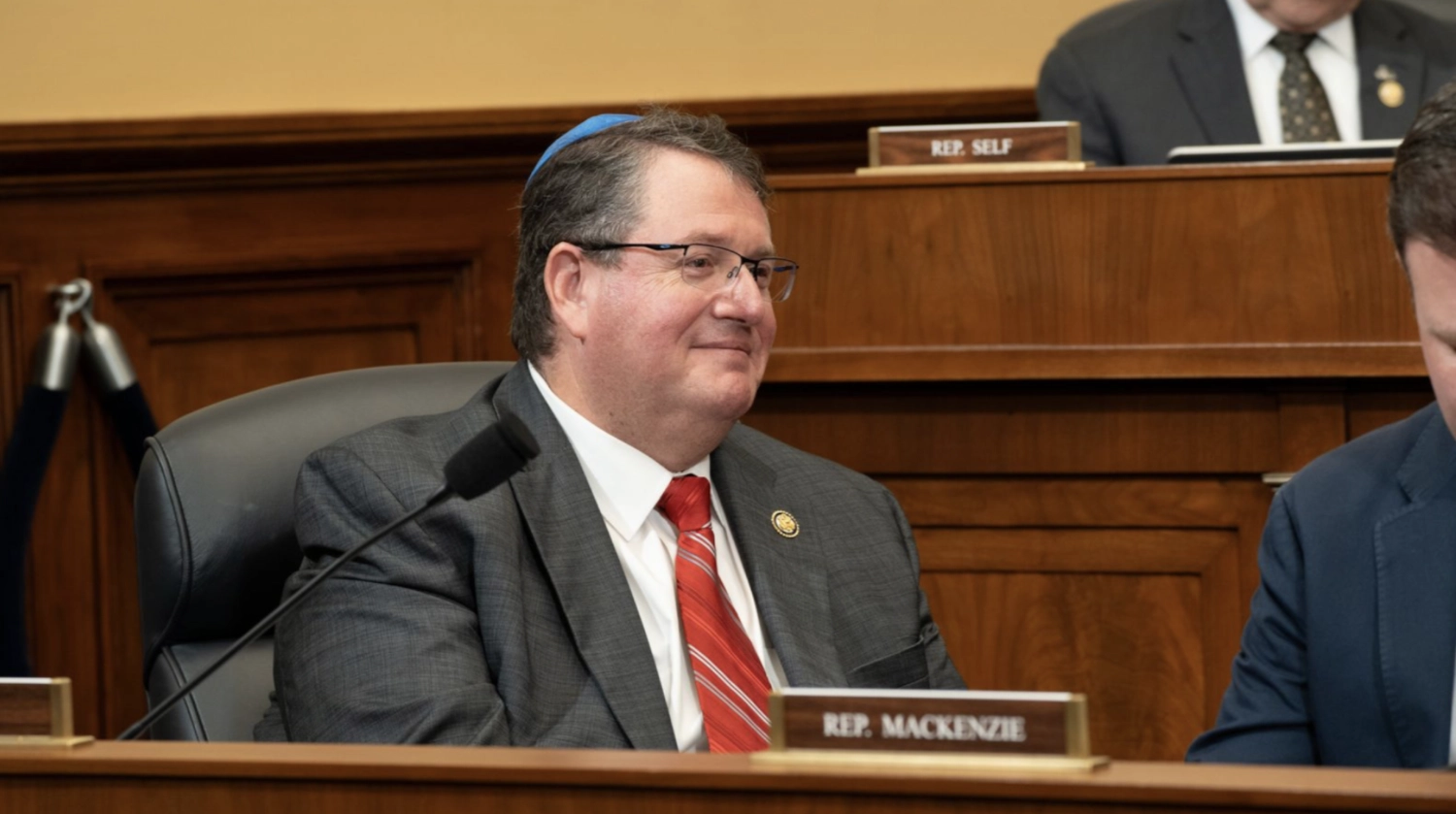 Rep. Randy Fine, Republican congressman from Florida, wearing a gray suit and red tie during a House committee hearing