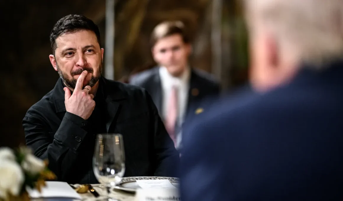 Ukrainian President Volodymyr Zelenskyy listens during a meeting with US President Donald Trump at Mar-a-Lago, December 2025