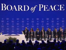 Board of Peace signing ceremony in Davos with delegates seated on stage as a speaker addresses the audience, 22 January 2026