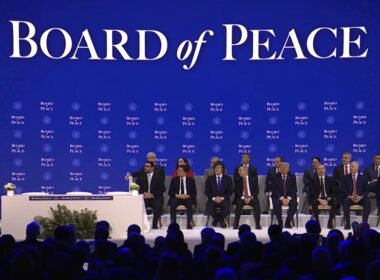Board of Peace signing ceremony in Davos with delegates seated on stage as a speaker addresses the audience, 22 January 2026