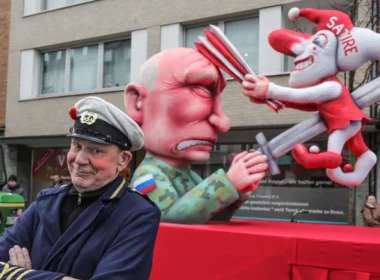 russia prosecuting german carnival float builder — responded making another putin · post sculptor jacques tilly standing front depicting grim impaling jester labeled satire sword during rose parade dusseldorf 16