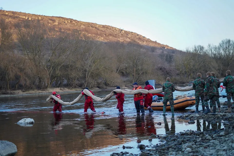 russia hit ukraine's hydropower plant eight days ago — poisoned river crossing moldova · post romanian response team moldovan military personnel deploying absorbent booms dniester contain oil contamination caused russia's