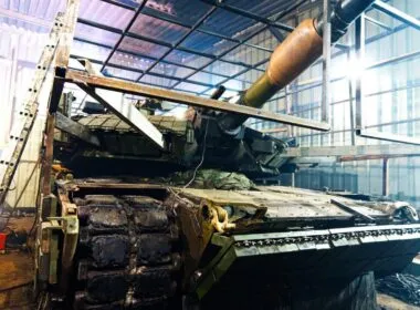 A 1st Assault Regiment M-1 getting add-on armor.